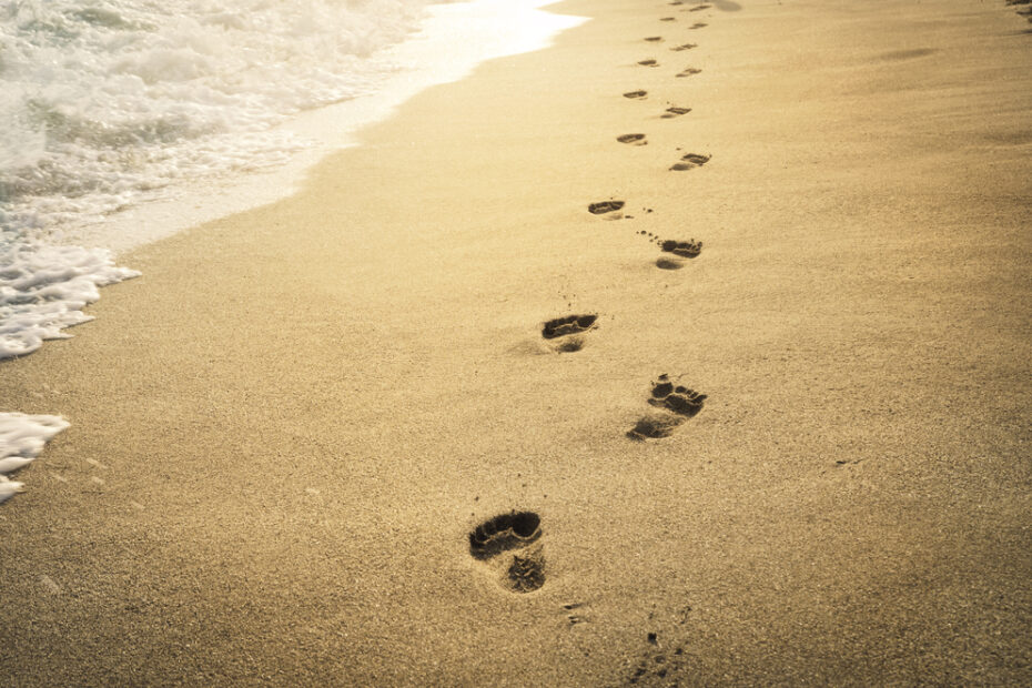 Feet walking in the sand